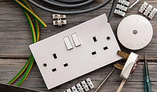 a white switch and wires on a table 